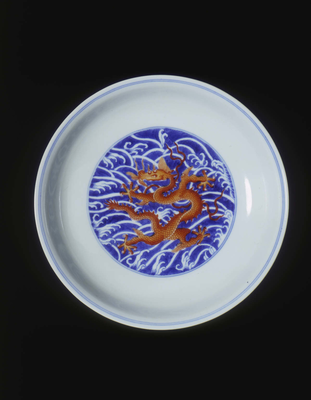 Dish with red Imperial dragon against blue waved