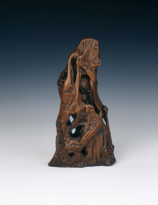 Natural wood sculpture of mountain with four