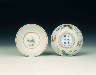 Pair of polychrome bowls with squirrels and