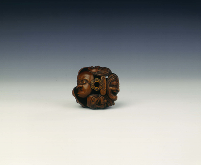 Wooden netsuke of seven Noh masks by Koyosai