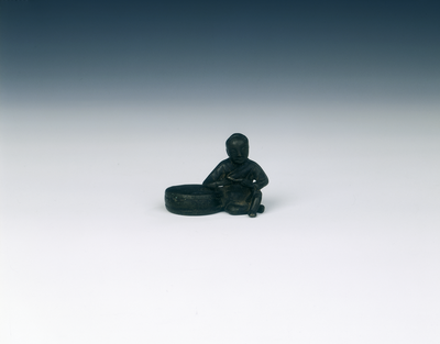 Bronze group paper weight of boy reading seated