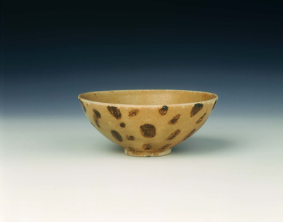 Bowl with yellowish-green glaze with brown spots