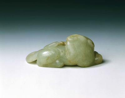 Jade Buddhist lion dog with lingzhi fungus in its