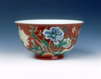 Polychrome bowl with flowers on coral ground
