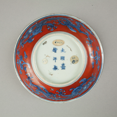 Red clobbered blue and white saucer with stork