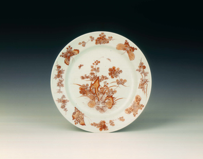 Rouge de fer and gilt plate with butterflies