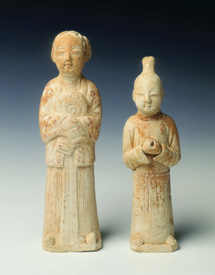 Unglazed pottery figures of a page and maid