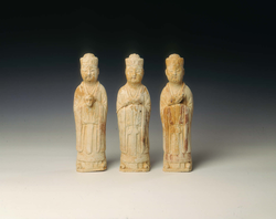 Set of three pottery figures holding zodiac