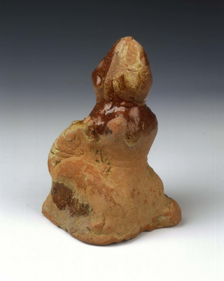Brown lead glaze pottery squatting dwarf
Late