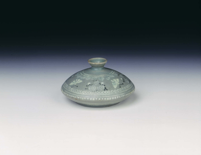 Celadon oil jar with inlaid design of moths and
