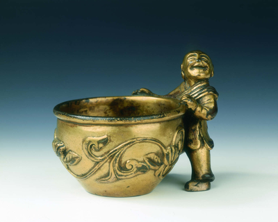 Gilt bronze water container with a boy holding