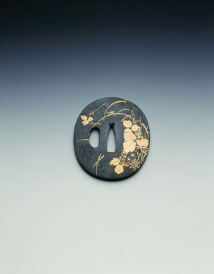 Tsuba (sword hilt) in shakudo with gold inlays of