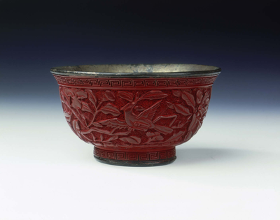 Carved lacquer bowl with birds among peonies Late