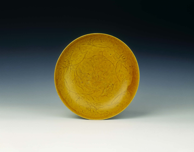 Yellow glazed dish with stylized floral