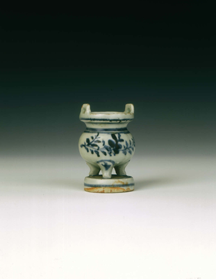 Miniature blue and white incense burner on