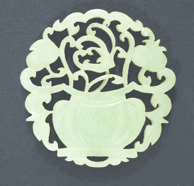 Circular openwork jade plaque with pot of fruit