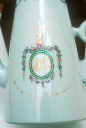 Conical coffee pot and lid with crest of