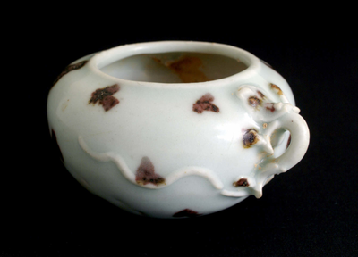 Underglaze red and brown spotted water container
