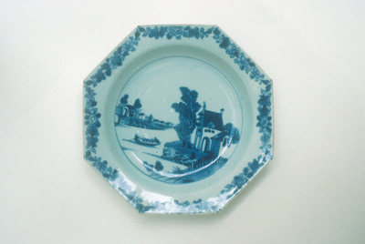 Octagonal blue and white plate with Dutch housec