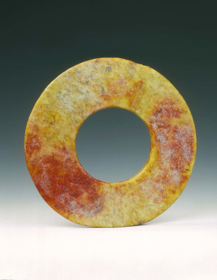 Altered jade bi-disc with russet patchesNeolithic