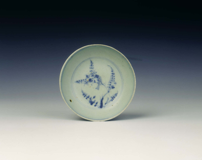 Blue and white saucer with bird on tree
Second