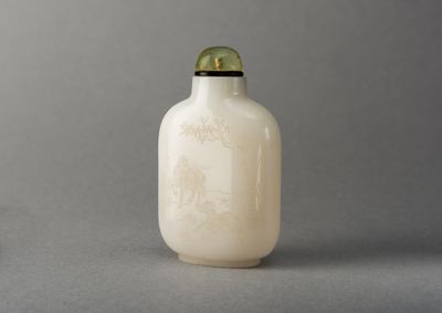 White glass snuff bottle with carving of 2 horses