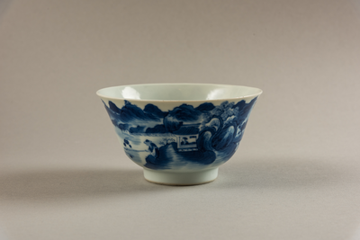 Blue and white bowl with land/seascape design