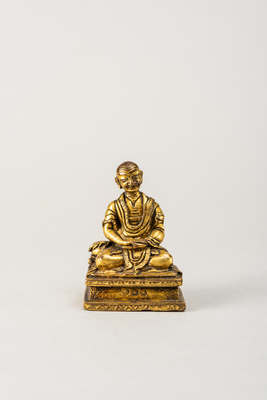 Gilt-bronze monk with alms bowl on