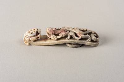 Greyish-white burnt jade belt hook with dragon's