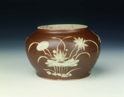 Brown jar with herons and lotus in white