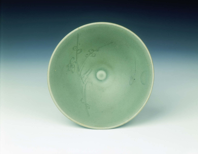 Celadon bowl with prunus spray under a crescent