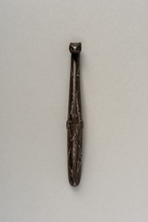 Bronze garment hook with silver inlays
Late
