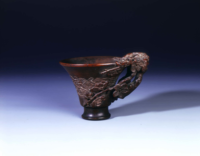 Footed rhino horn cup with prunus in high relief