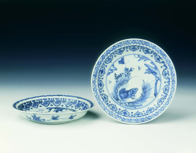 Pair of blue and white saucers with frogs