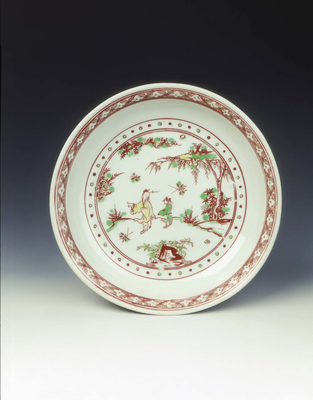 Polychrome saucer with sage and attendant in a