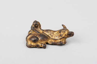 Gilded iron group of buffalo lying down with